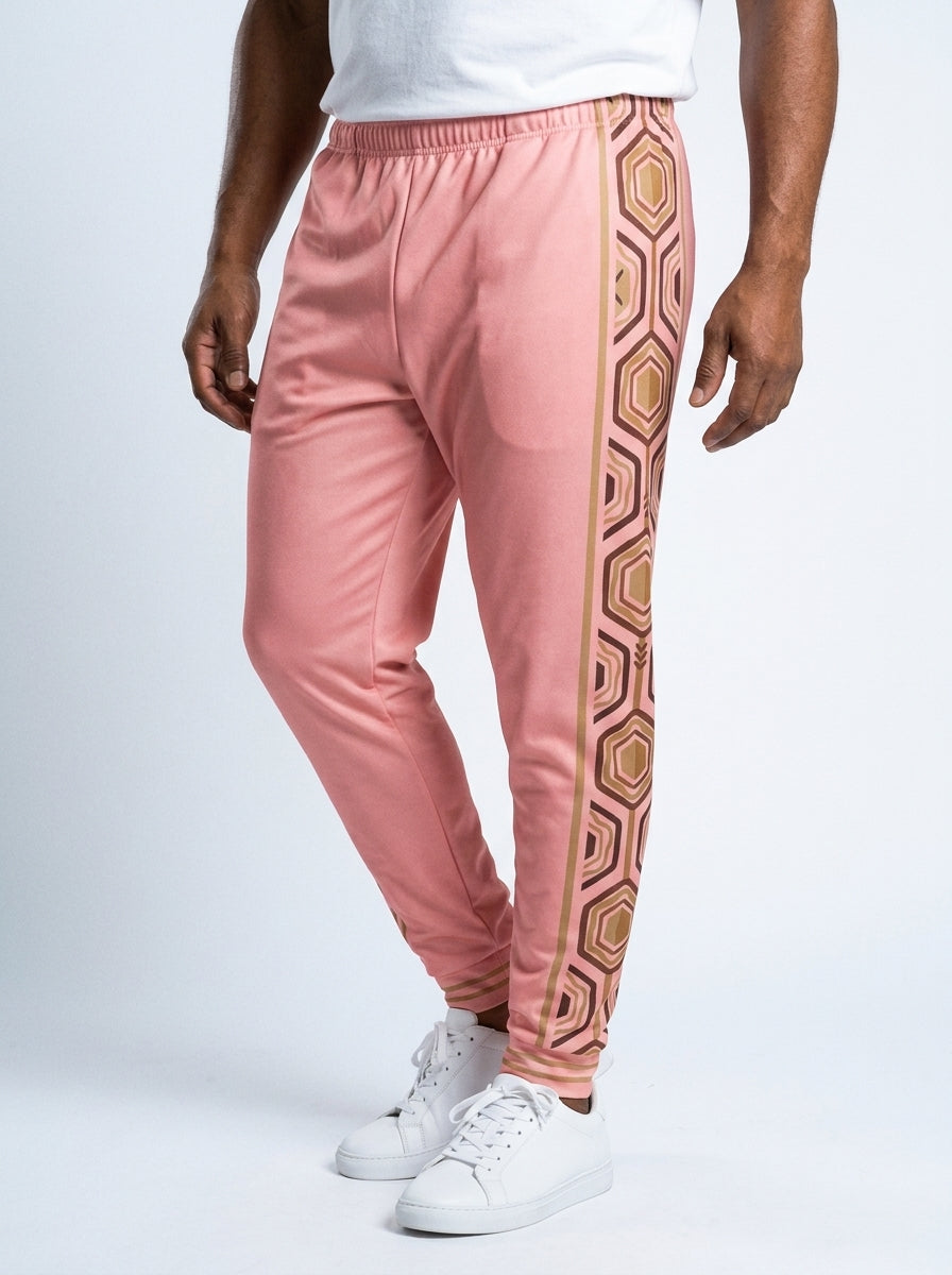 AnanseNova™ Men's Joggers in Eze Pink, three-quarter right view on model — slim tapered leg, striped ribbed ankle cuffs. SunBorn