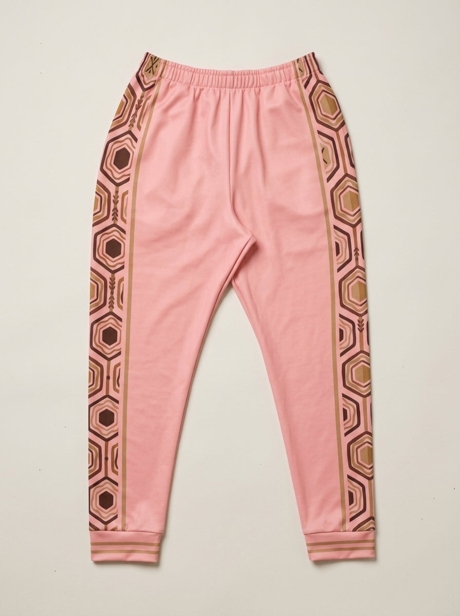 AnanseNova™ Men's Joggers in Eze Pink, flat lay — hexagon side panels on both legs, elastic drawstring waistband. SunBorn