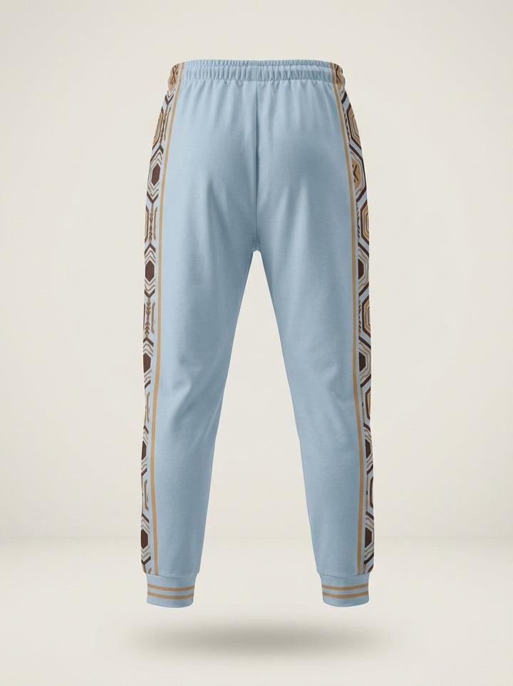 AnanseNova™ Men's Joggers in Igwe Blue, ghost mannequin back view — hexagon side panels, elastic waistband. SunBorn