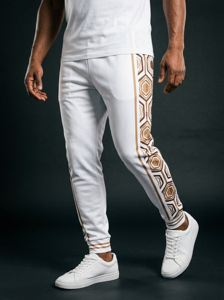 AnanseNova™ Men's Joggers in Ocha White, front view on model — AnanseNova™ hexagon side-panel stripe edged in bronze pinstripes, striped ribbed ankle cuffs. SunBorn