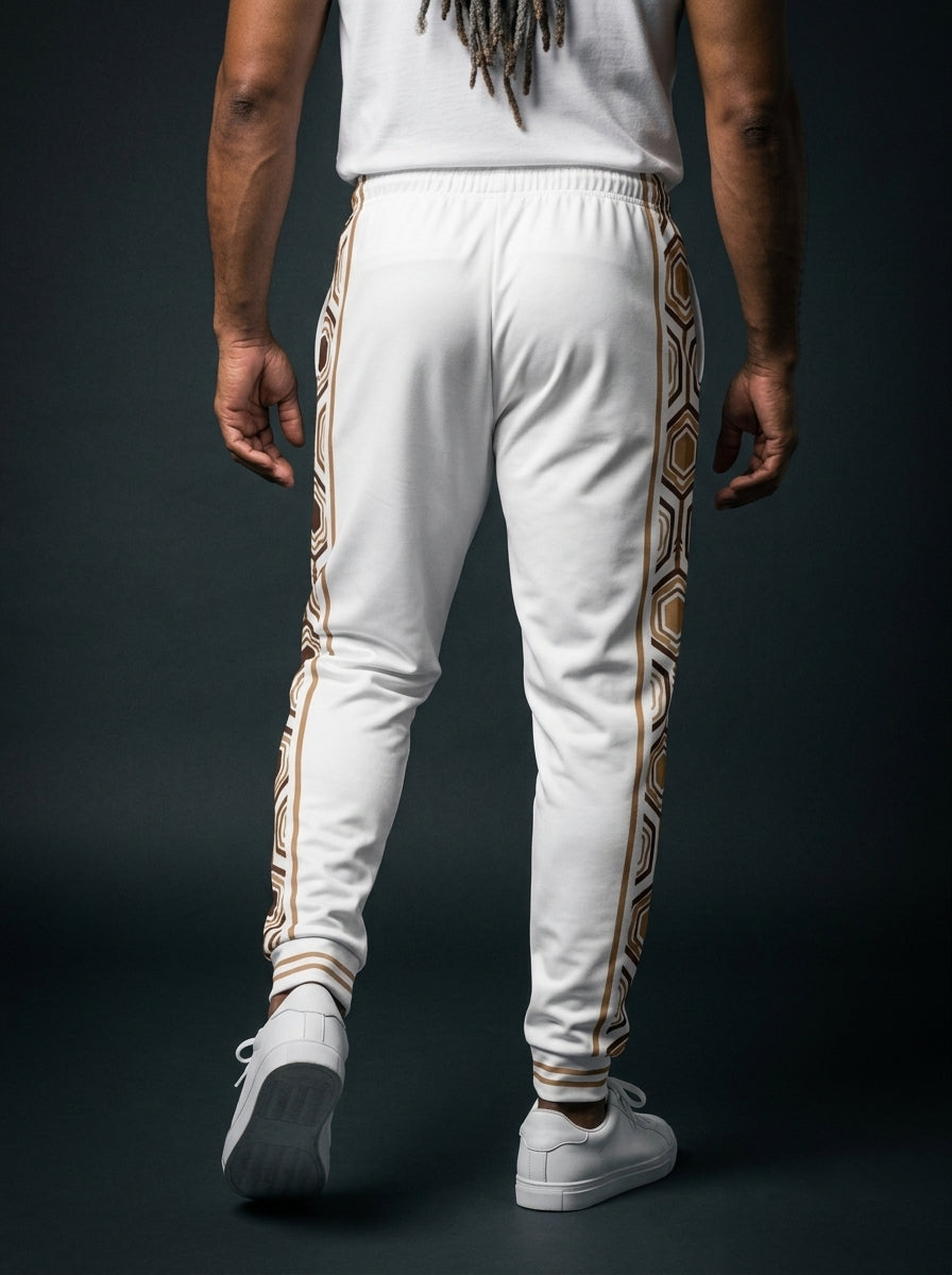 AnanseNova™ Men's Joggers in Ocha White, back view on model — hexagon side panels running waist to cuff, slim athletic fit. SunBorn