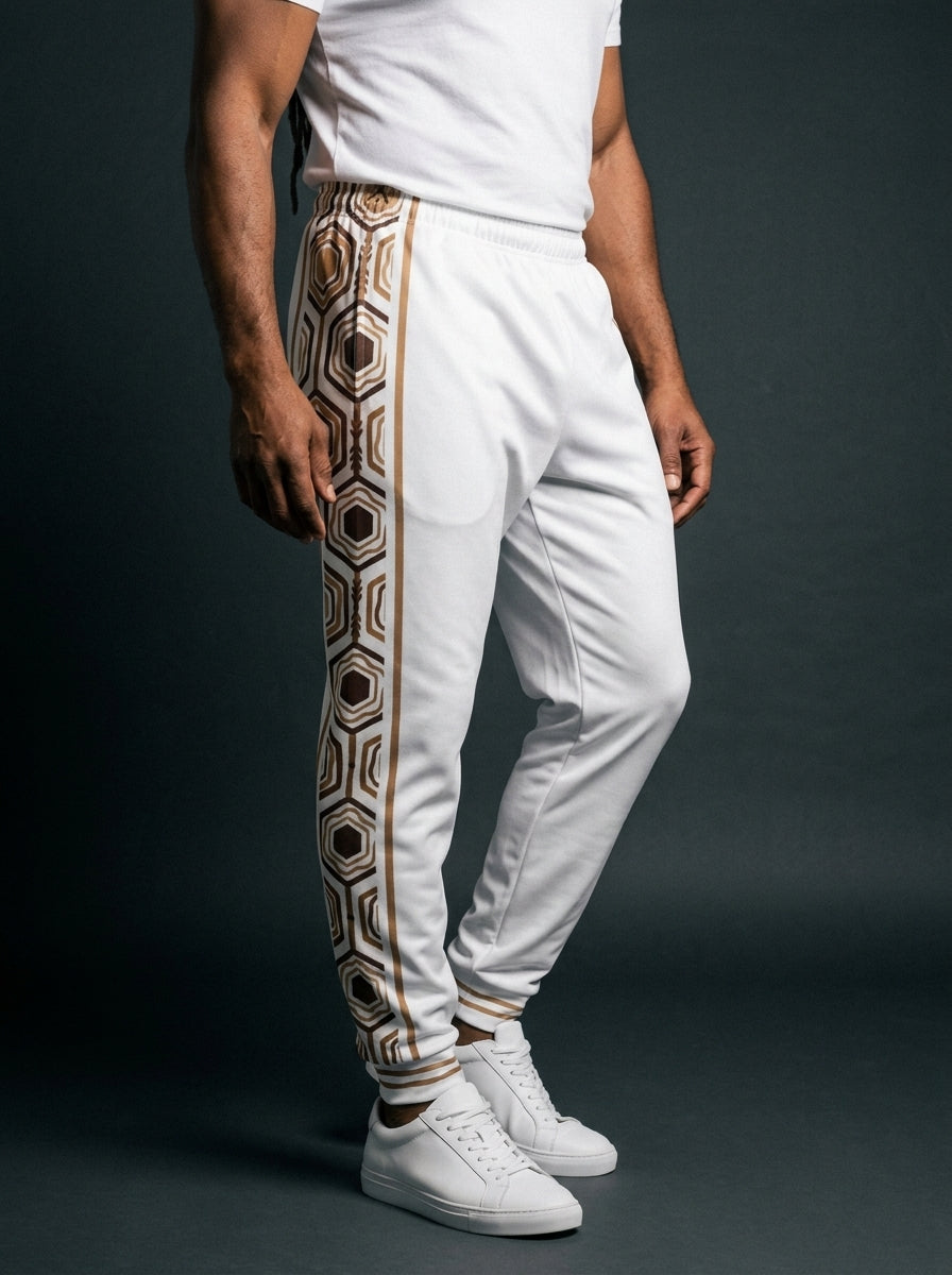 AnanseNova™ Men's Joggers in Ocha White, three-quarter left view on model — hexagon web-cell side panel with bronze pinstripe. SunBorn
