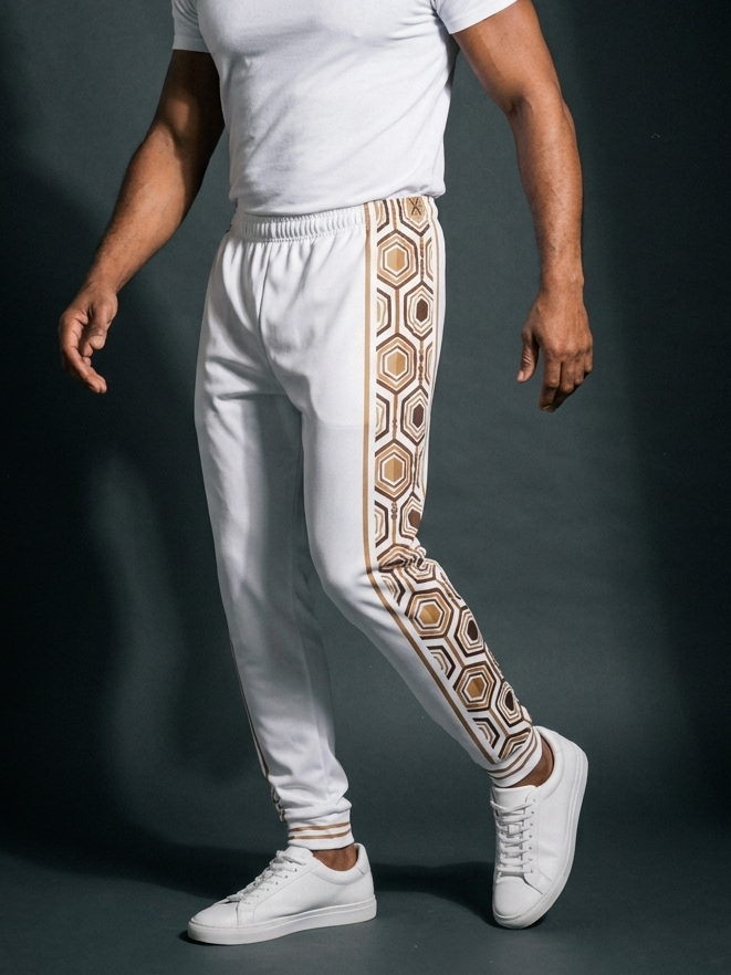 AnanseNova™ Men's Joggers in Ocha White, three-quarter right view on model — slim tapered leg, striped ribbed ankle cuffs. SunBorn