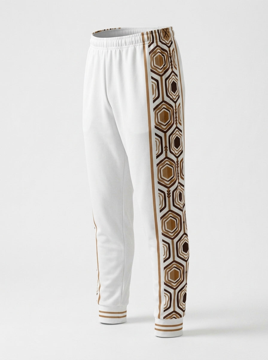 AnanseNova™ Men's Joggers in Ocha White, ghost mannequin three-quarter left view — hexagon side panel and bronze pinstripe. SunBorn