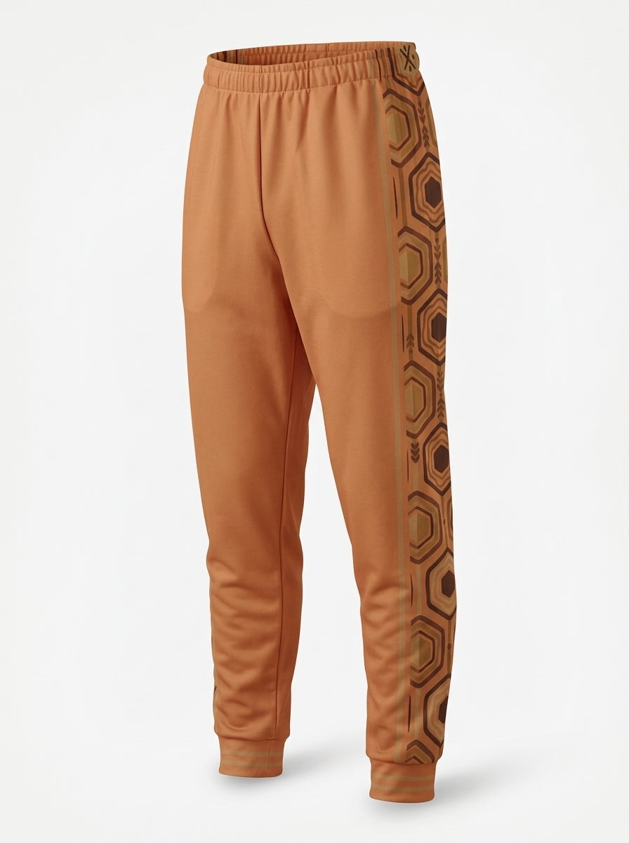AnanseNova™ Men's Joggers in Sango Orange, ghost mannequin three-quarter left view — hexagon side panel and bronze pinstripe. SunBorn