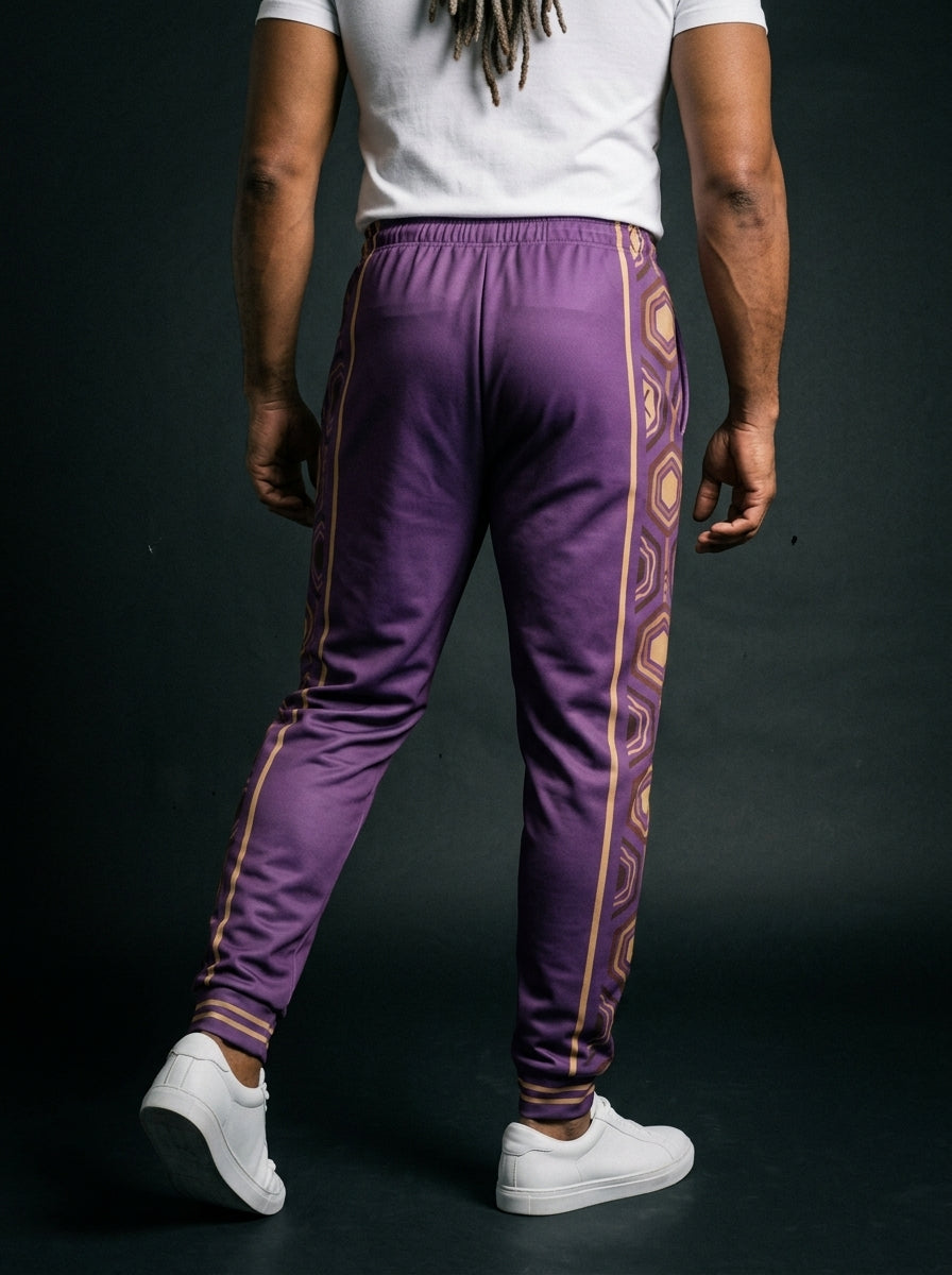 AnanseNova™ Men's Joggers in Ugo Purple, back view on model — hexagon side panels running waist to cuff, slim athletic fit. SunBorn