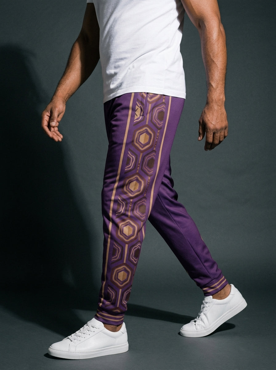 AnanseNova™ Men's Joggers in Ugo Purple, three-quarter left view on model — hexagon web-cell side panel with bronze pinstripe. SunBorn