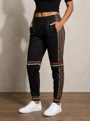 N'Donso™ Women's Joggers in Uhie Red, worn front — Hunter's Road side stripe