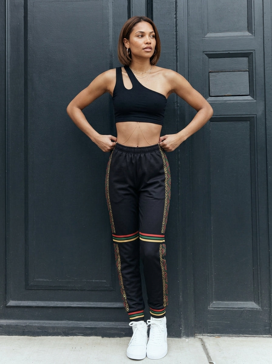 N'Donso™ Women's Uhie Red joggers worn on the street, lifestyle