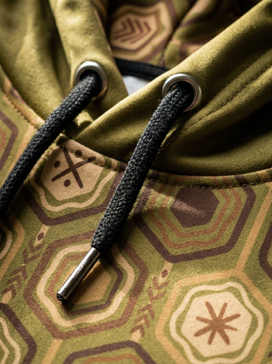 AnanseNova™ // Statement Hoodie in Ubi Green — macro detail — SunBorn