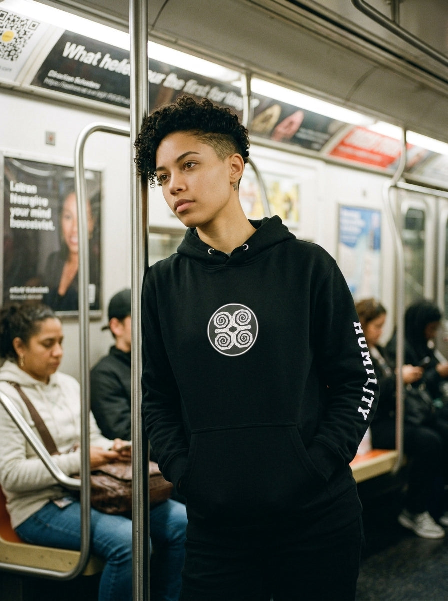 SunBorn Adinkra // Humility Hoodie in Oji Black, styled in a real-world lifestyle setting