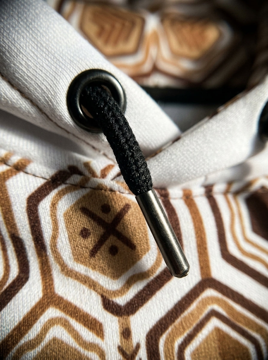 AnanseNova™ // Statement Hoodie in Ocha White — macro detail — SunBorn