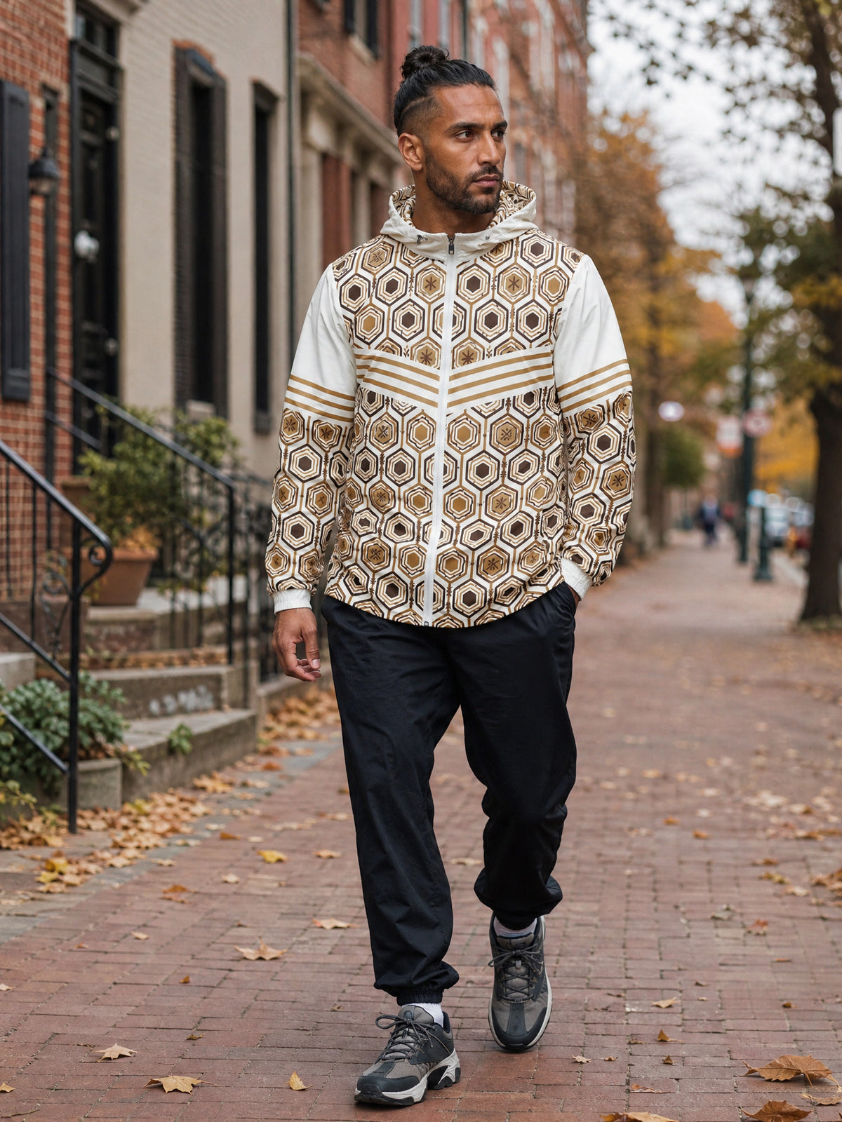 AnanseNova™ Men's Windbreaker in Ocha White — worn on a Philadelphia rowhouse street, autumn street style