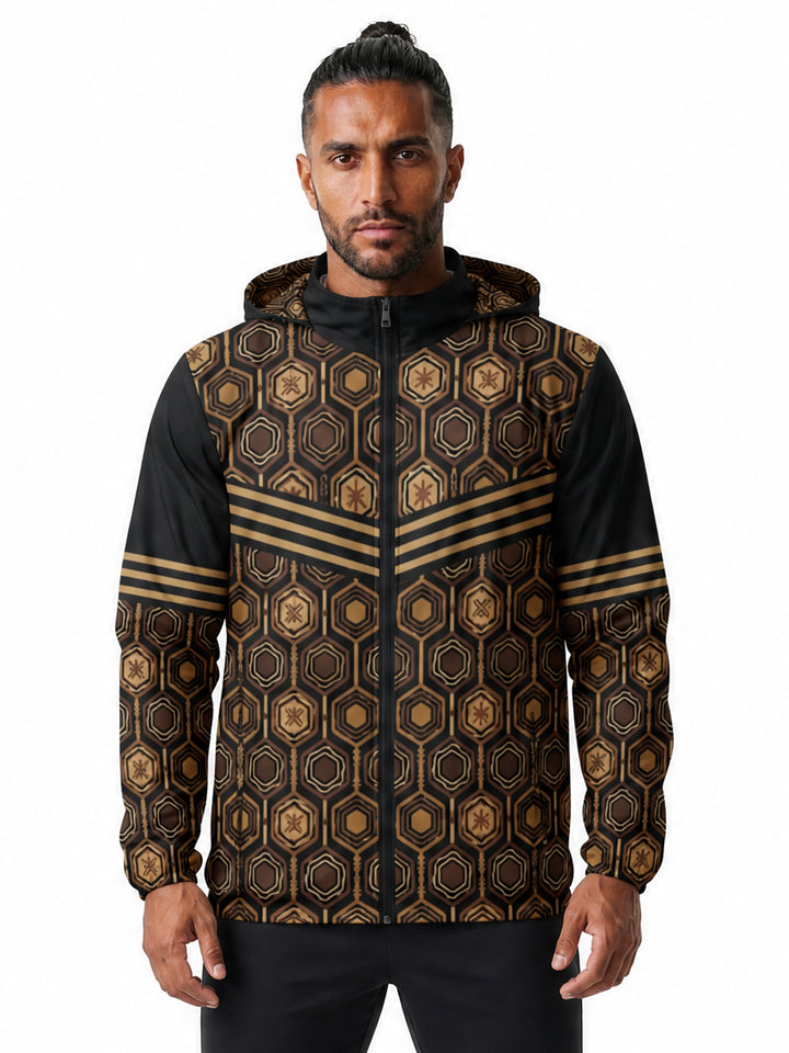 AnanseNova™ Men's Windbreaker in Oji Black — front view on model, AnanseNova™ hexagon all-over print with bronze triple-stripe chevron