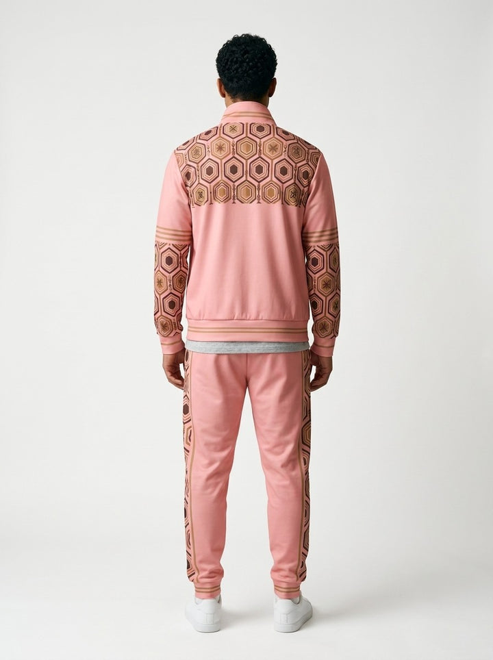 AnanseNova™ Track Jacket + Joggers Set in Eze Pink, back view on model showing the hexagon print yoke, printed sleeves and jogger side stripes