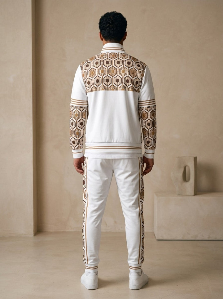 AnanseNova™ Track Jacket + Joggers Set in Ocha White, back view on model showing the hexagon print yoke, printed sleeves and jogger side stripes