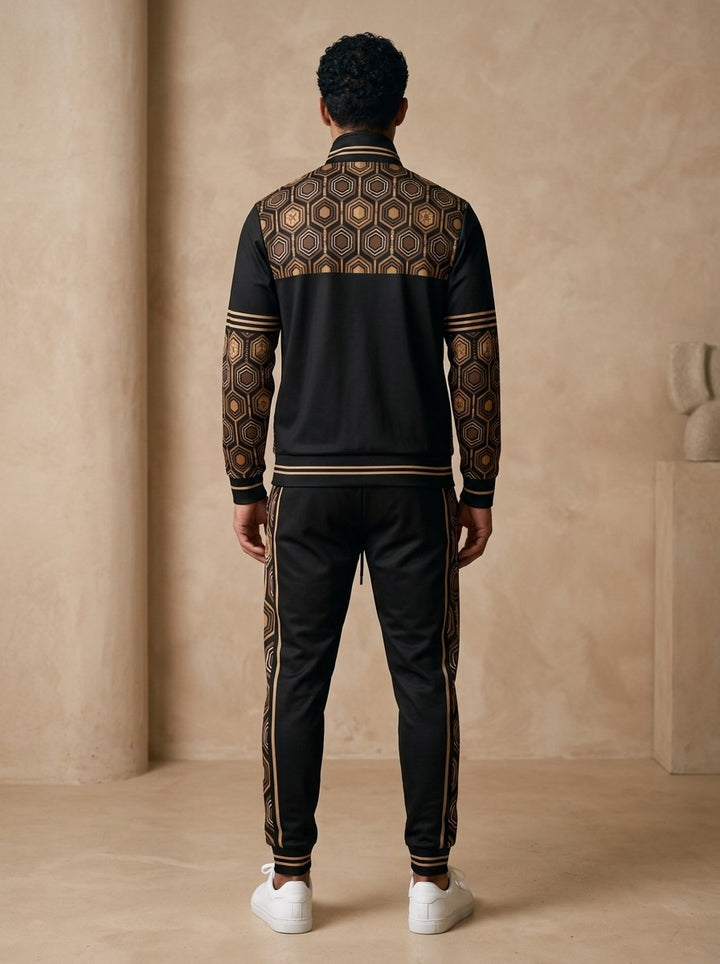 AnanseNova™ Track Jacket + Joggers Set in Oji Black, back view on model showing the hexagon print yoke, printed sleeves and jogger side stripes