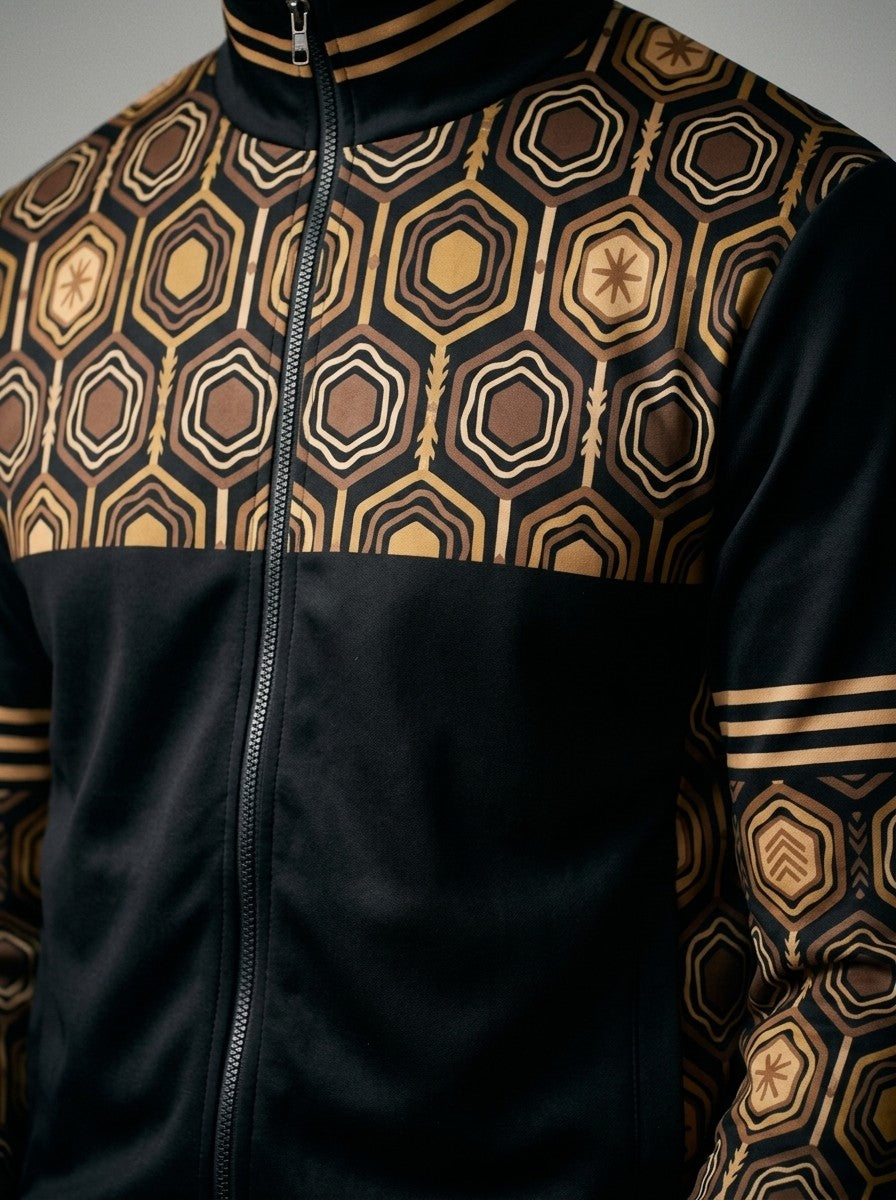 Close-up of the AnanseNova™ Track Jacket in Oji Black: striped stand collar, zip and the hexagon print yoke and sleeve