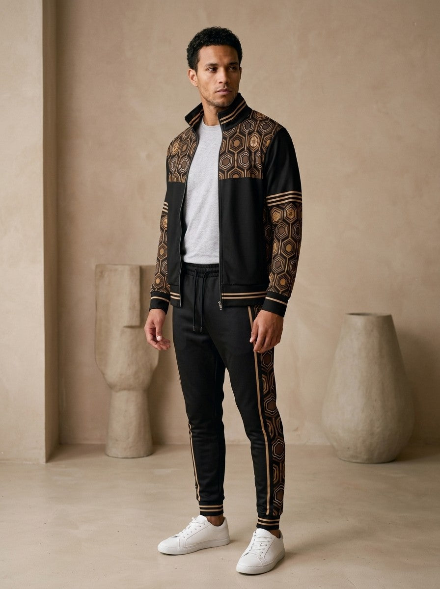 AnanseNova™ Track Jacket + Joggers Set in Oji Black, three-quarter left view on model showing the printed sleeve and jogger side panel