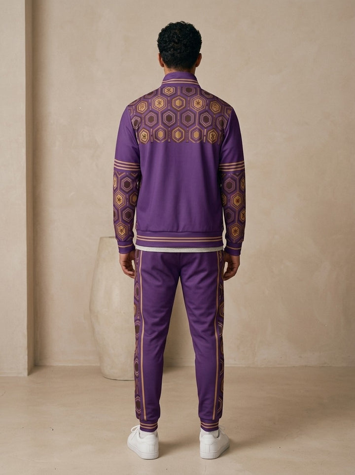 AnanseNova™ Track Jacket + Joggers Set in Ugo Purple, back view on model showing the hexagon print yoke, printed sleeves and jogger side stripes