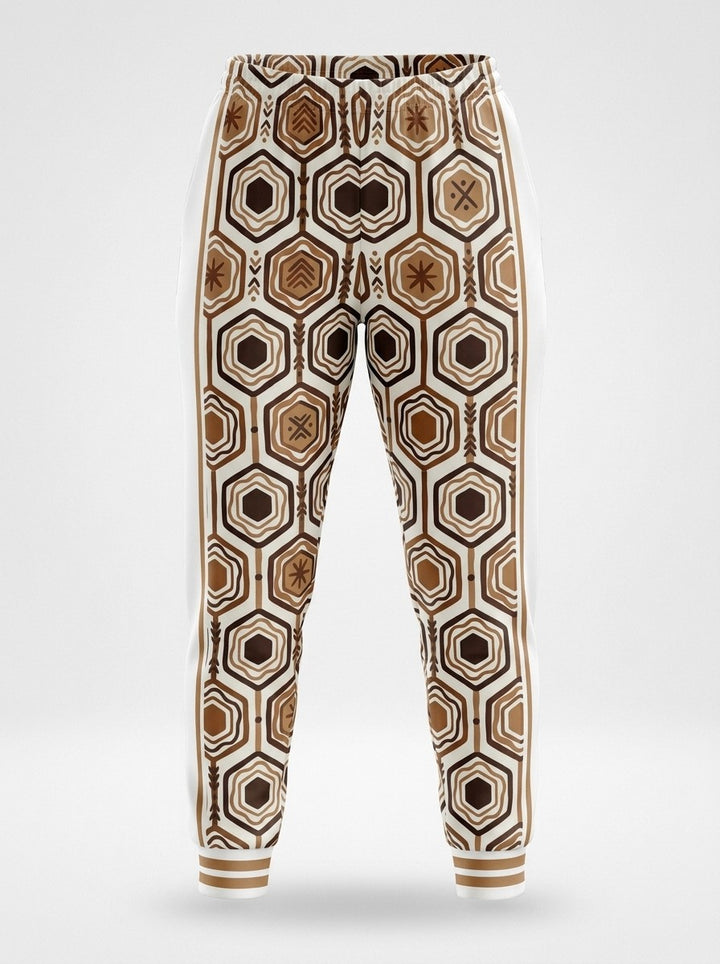 Ghost-mannequin front view of AnanseNova™ Women's Joggers in Ocha White, AnanseNova™ hexagon print across both legs with bronze-striped rib cuffs