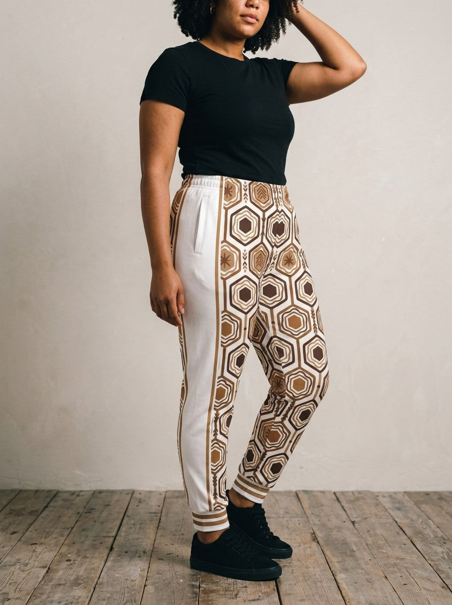Opposite three-quarter view of AnanseNova™ Women's Joggers in Ocha White showing the white side panel, bronze side stripe and pocket