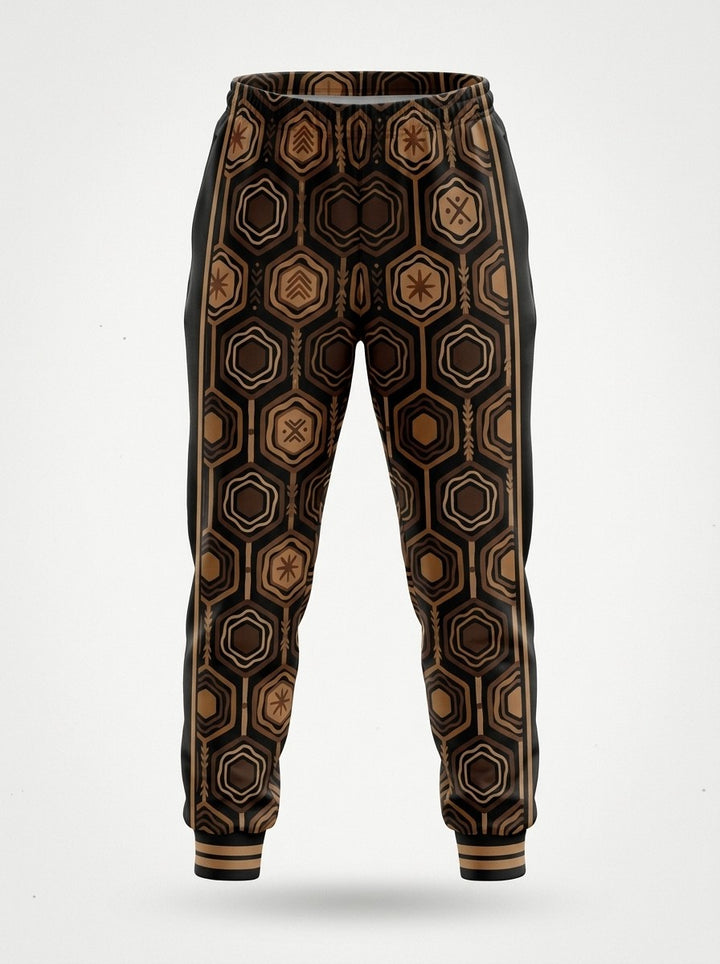 Ghost-mannequin front view of AnanseNova™ Women's Joggers in Oji Black, AnanseNova™ hexagon print across both legs with bronze-striped rib cuffs
