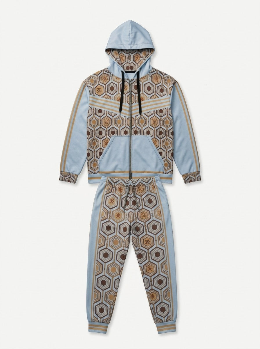 Flat lay of the Igwe Blue AnanseNova™ women's Zip Hoodie and Joggers side by side, showing the printed hood lining, chest web and full-leg hexagon print | SunBorn