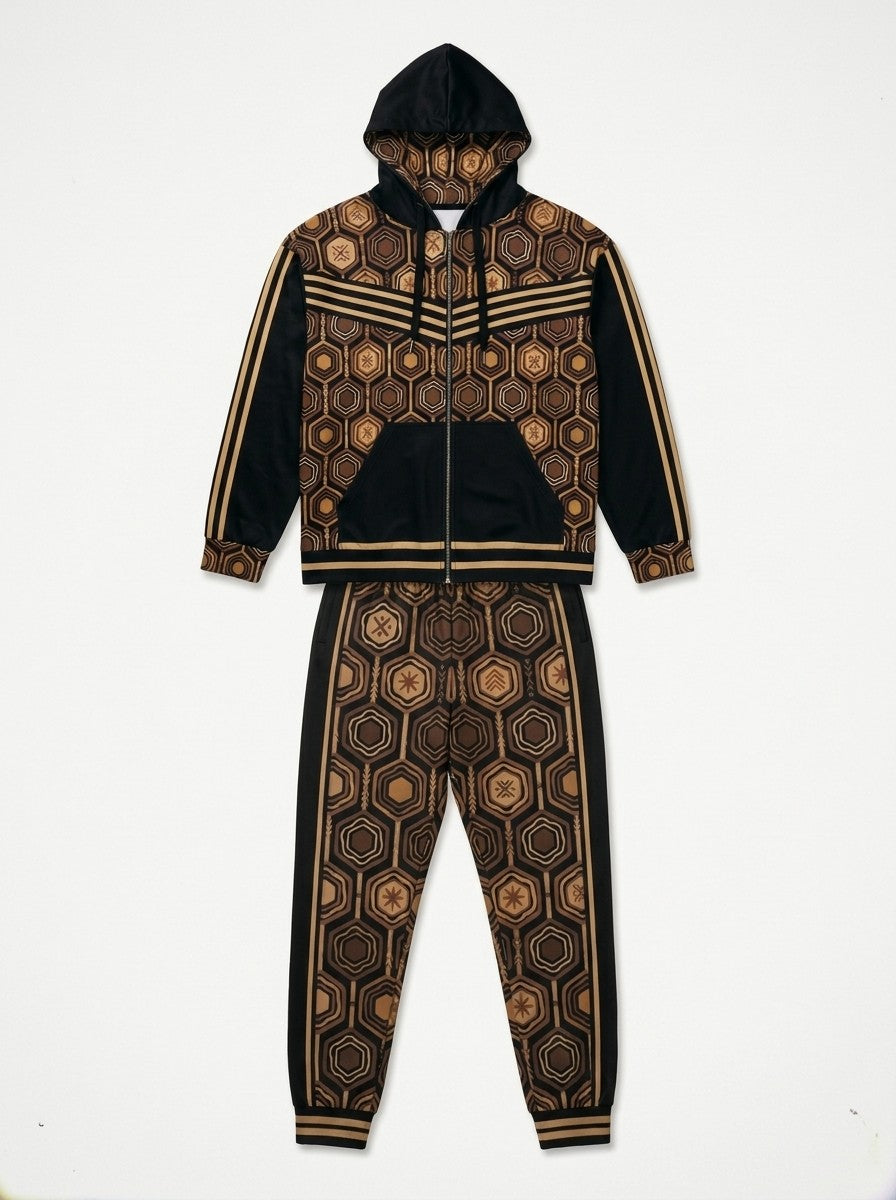Flat lay of the Oji Black AnanseNova™ women's Zip Hoodie and Joggers side by side, showing the printed hood lining, chest web and full-leg hexagon print | SunBorn