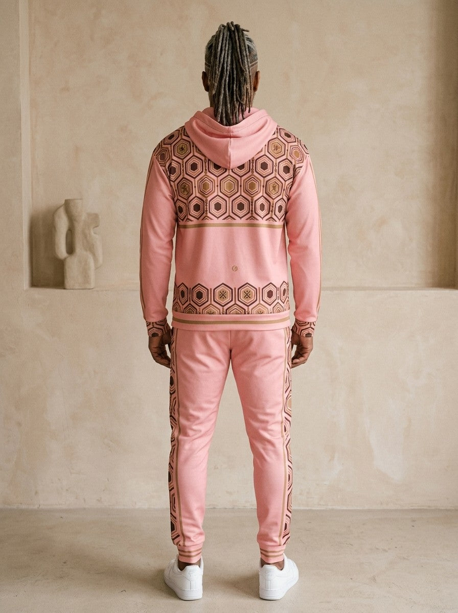 AnanseNova™ Zip Hoodie + Joggers Set in Eze Pink, back view on model showing the hexagon print yoke and hem band and the joggers' side stripes