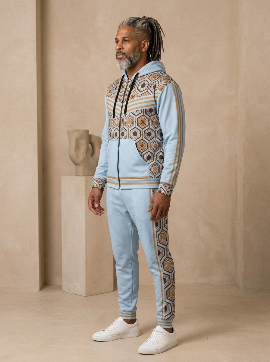 AnanseNova™ Zip Hoodie + Joggers Set in Igwe Blue, three-quarter view on model showing the sleeve stripes and jogger side panel