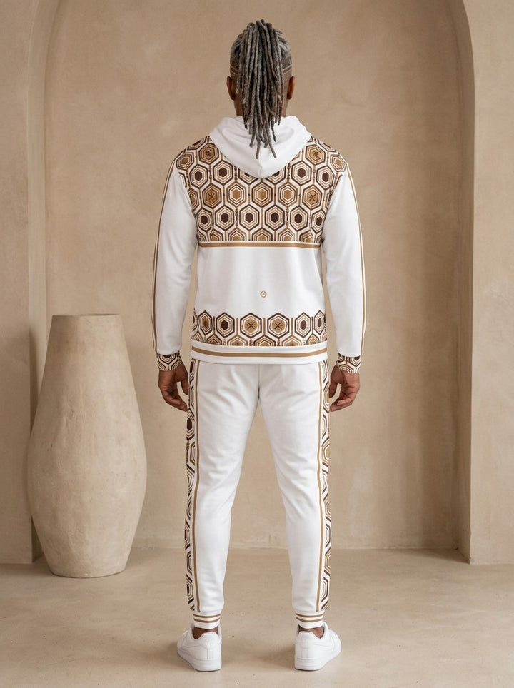 AnanseNova™ Zip Hoodie + Joggers Set in Ocha White, back view on model showing the hexagon print yoke and hem band and the joggers' side stripes