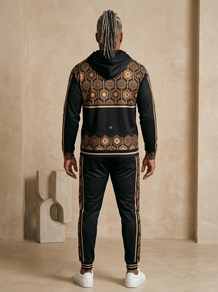 AnanseNova™ Zip Hoodie + Joggers Set in Oji Black, back view on model showing the hexagon print yoke and hem band and the joggers' side stripes