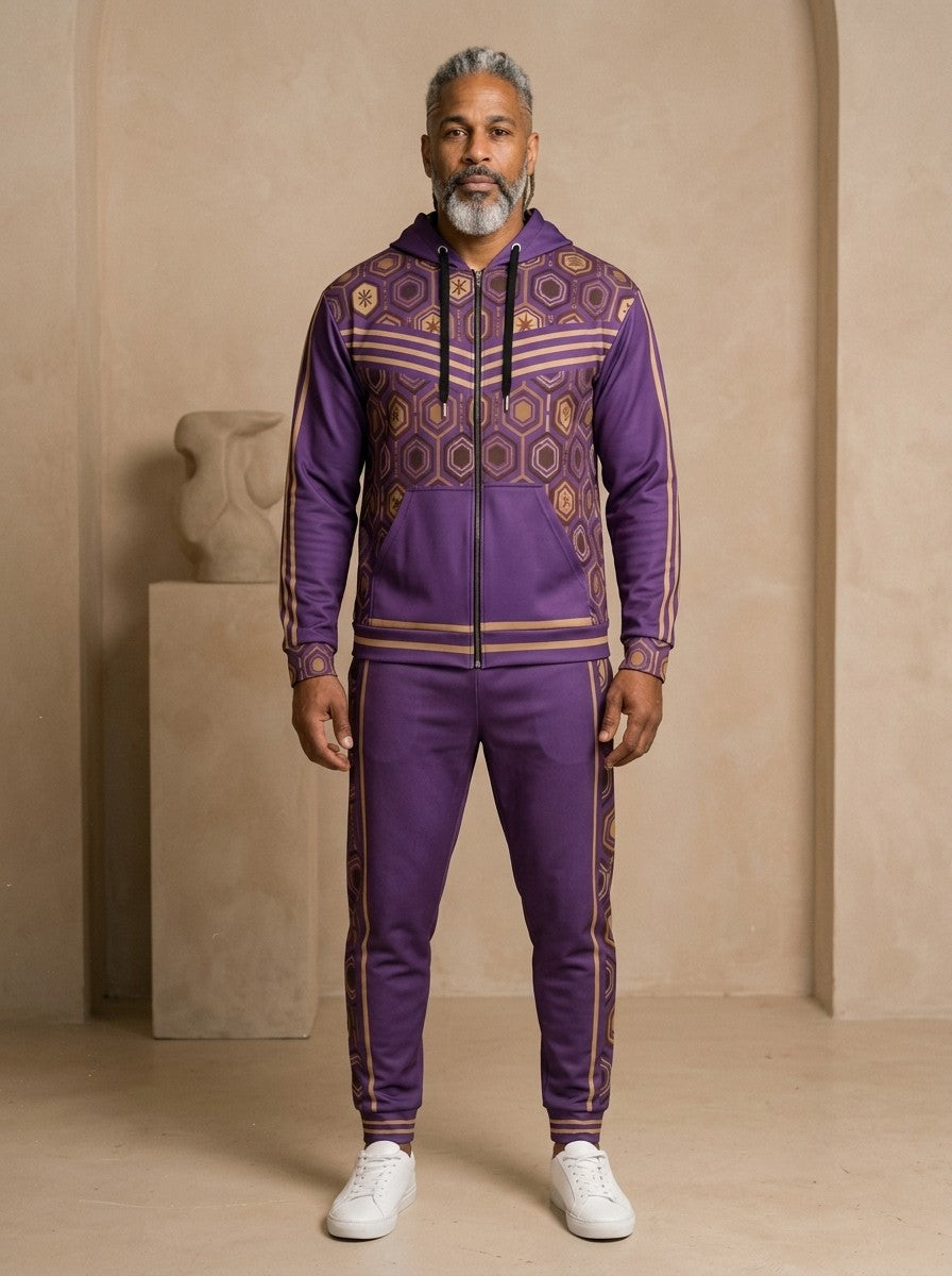 AnanseNova™ Zip Hoodie + Joggers Set in Ugo Purple, front view on model: purple zip hoodie with brown and gold hexagon print panels and gold sleeve stripes, matching purple joggers with hex side stripes