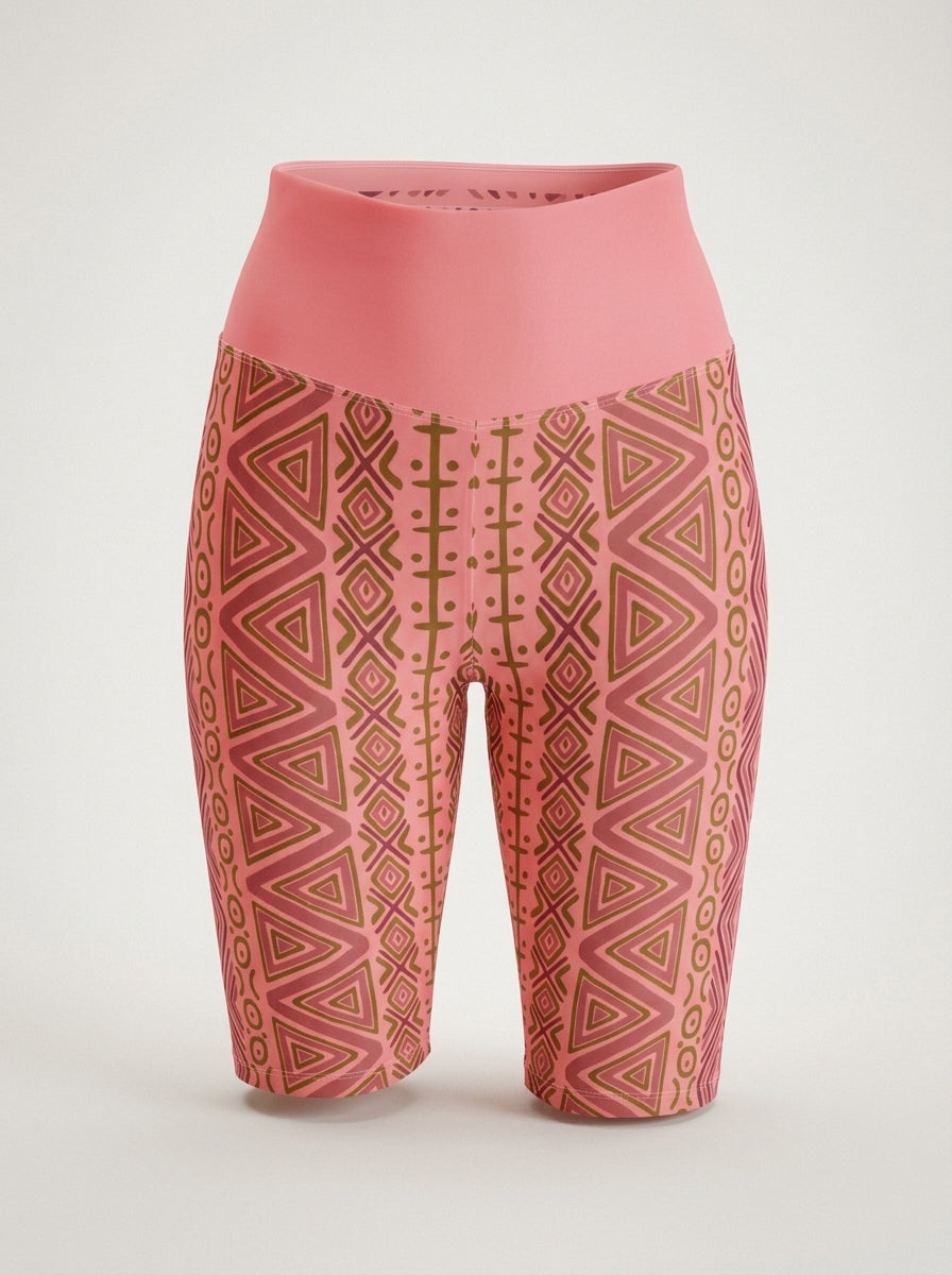 SunBorn N'Donso™ Biker Shorts in Adaeze Pink on a ghost mannequin, front view: zigzag columns, nested triangles and cross marks