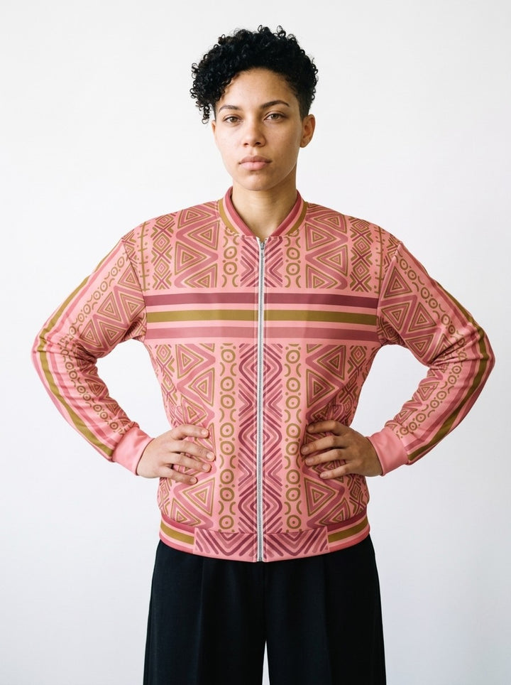 Model wearing the SunBorn N'Donso™ Bomber Jacket in Eze Pink, front view: Hunter's Road print, chest stripe band, ribbed baseball collar