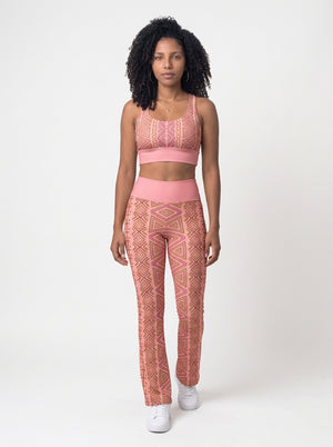 Front view of the N'Donso™ Bra + Flare Leggings Set in Adaeze Pink: Hunter's Road print longline sports bra and high-rise flare leggings by SunBorn