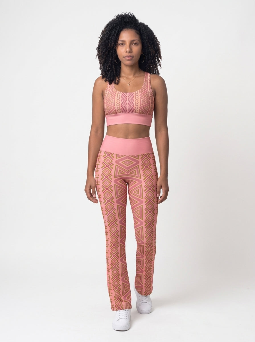 Front view of the N'Donso™ Bra + Flare Leggings Set in Adaeze Pink: Hunter's Road print longline sports bra and high-rise flare leggings by SunBorn
