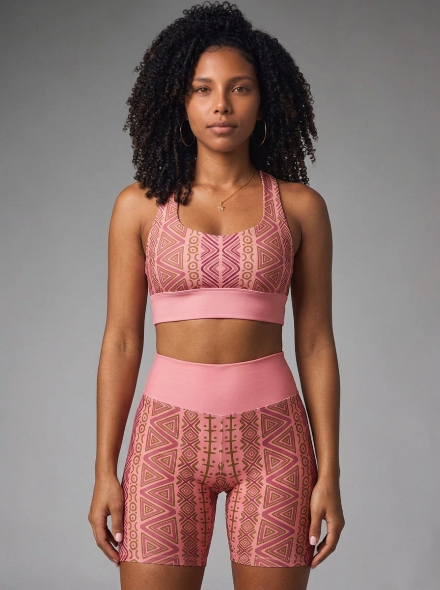 Close front view of the N'Donso™ Hunter's Road print in Adaeze Pink: zigzag columns, linked rings and nested triangles on the bra and shorts