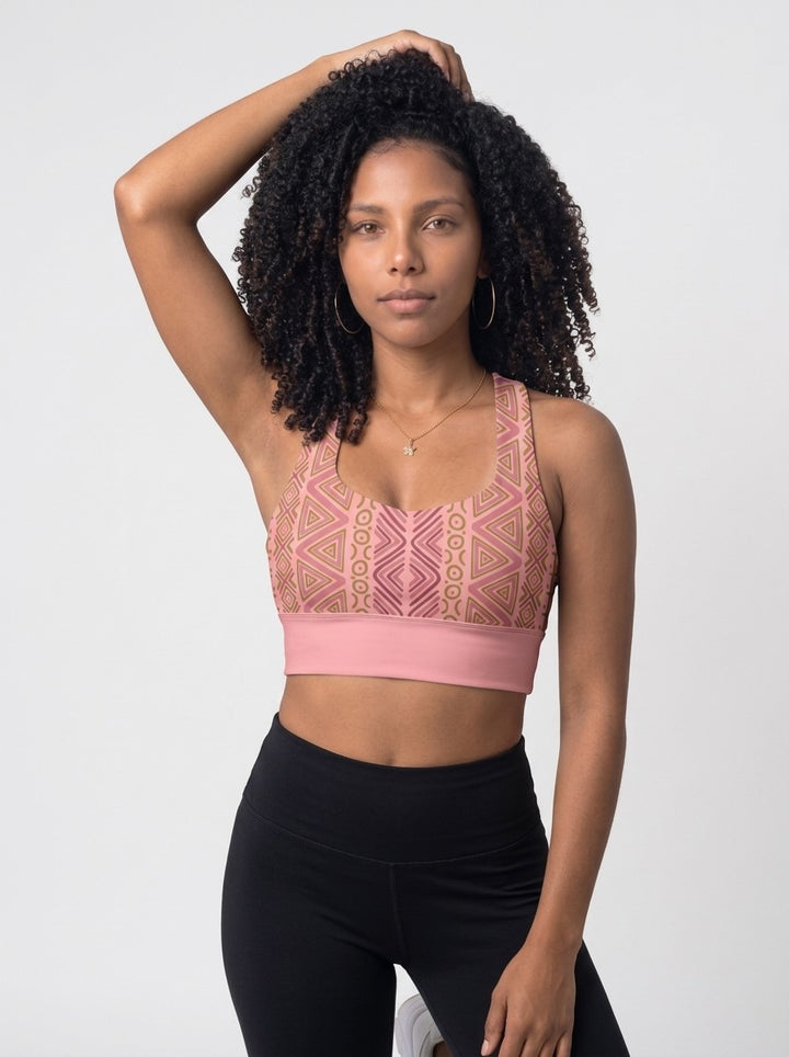 Woman wearing the SunBorn N'Donso™ Longline Bra in Adaeze Pink, front view: scoop neck, Hunter's Road print and solid pink underband