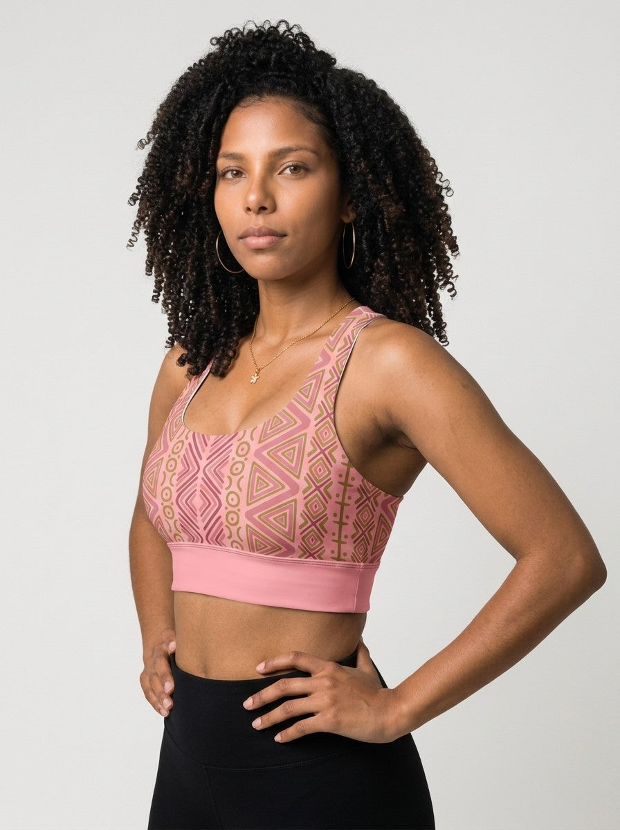 SunBorn N'Donso™ Longline Bra in Adaeze Pink, three-quarter left view on model with black leggings