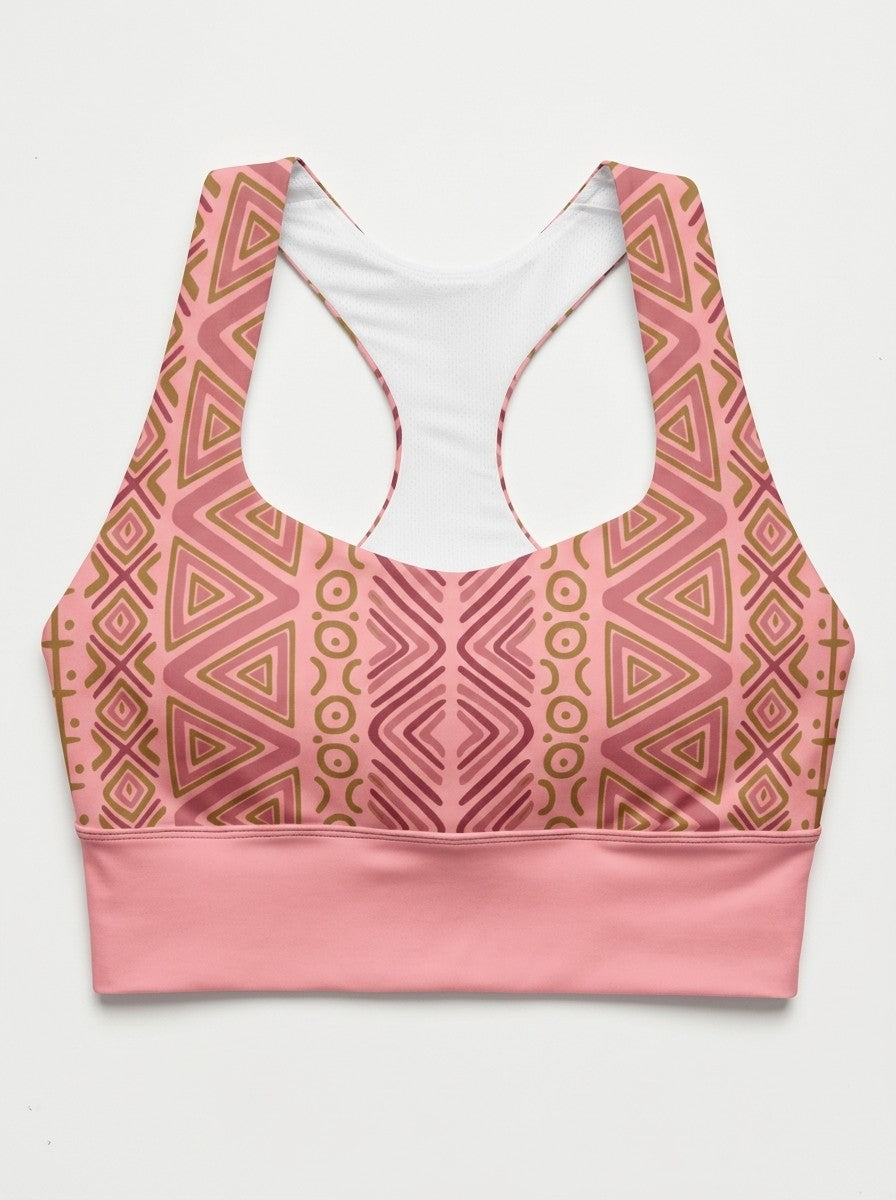 SunBorn N'Donso™ Longline Bra in Adaeze Pink laid flat: zigzag columns, rings and nested triangles, white mesh lining and racerback