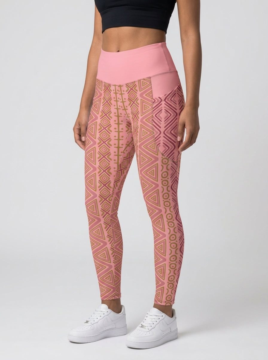 SunBorn N'Donso™ Pocket Leggings in Adaeze Pink, three-quarter left view on model showing the side pocket and print columns