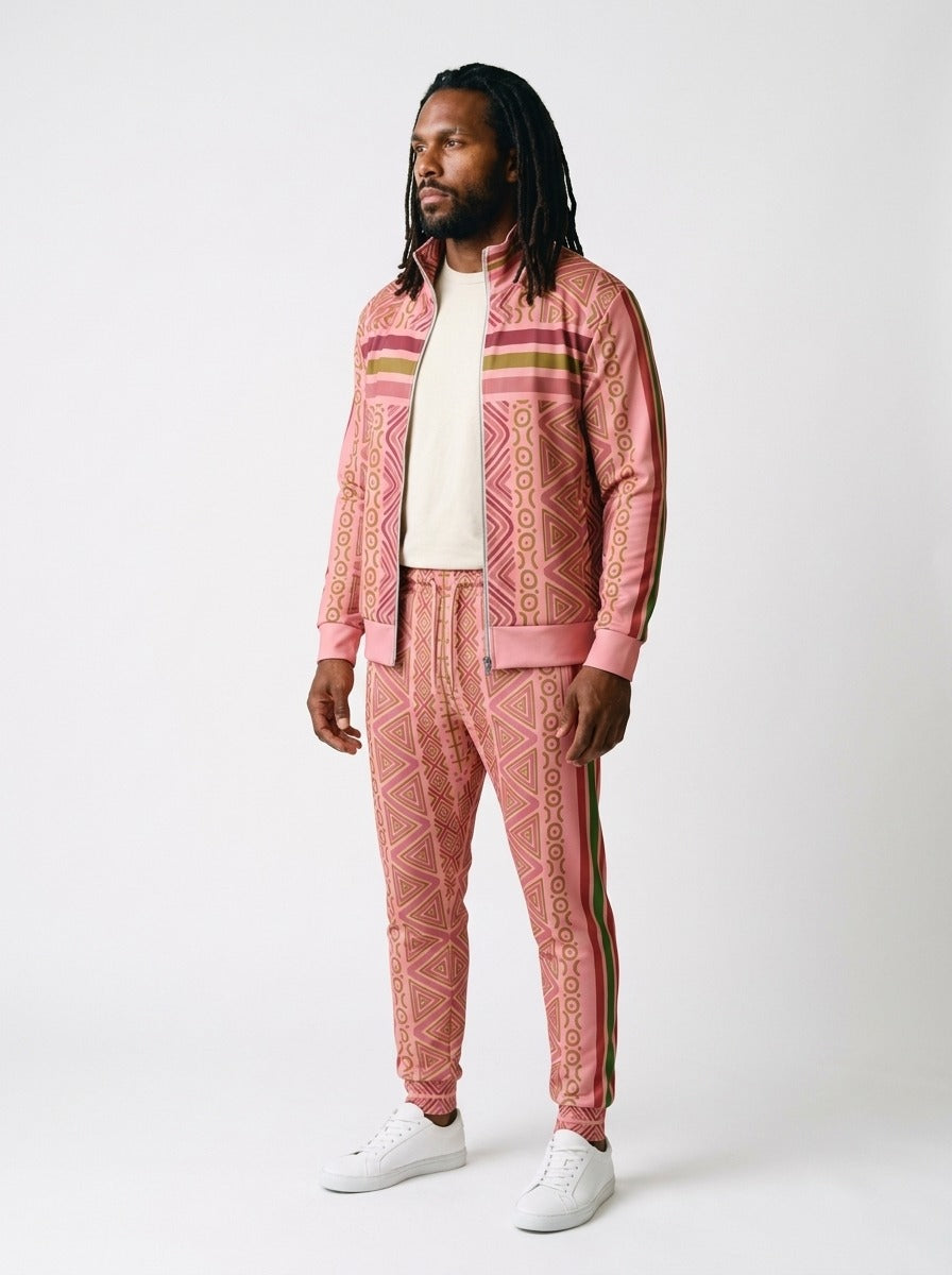 N'Donso™ Eze Pink tracksuit worn open over a white tee, three-quarter view showing sleeve and side-seam stripes
