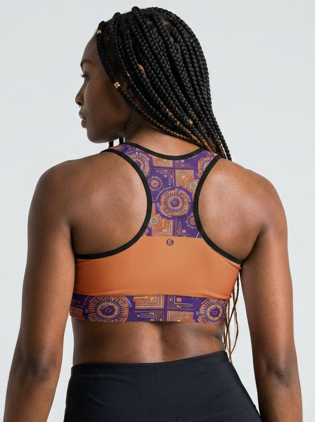 Sankofa Padded Sports Bra in the Sango Orange Kinetic Engine print, back view — SunBorn