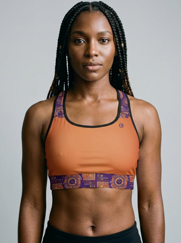 Sankofa Padded Sports Bra in the Sango Orange Kinetic Engine print, studio front view — SunBorn