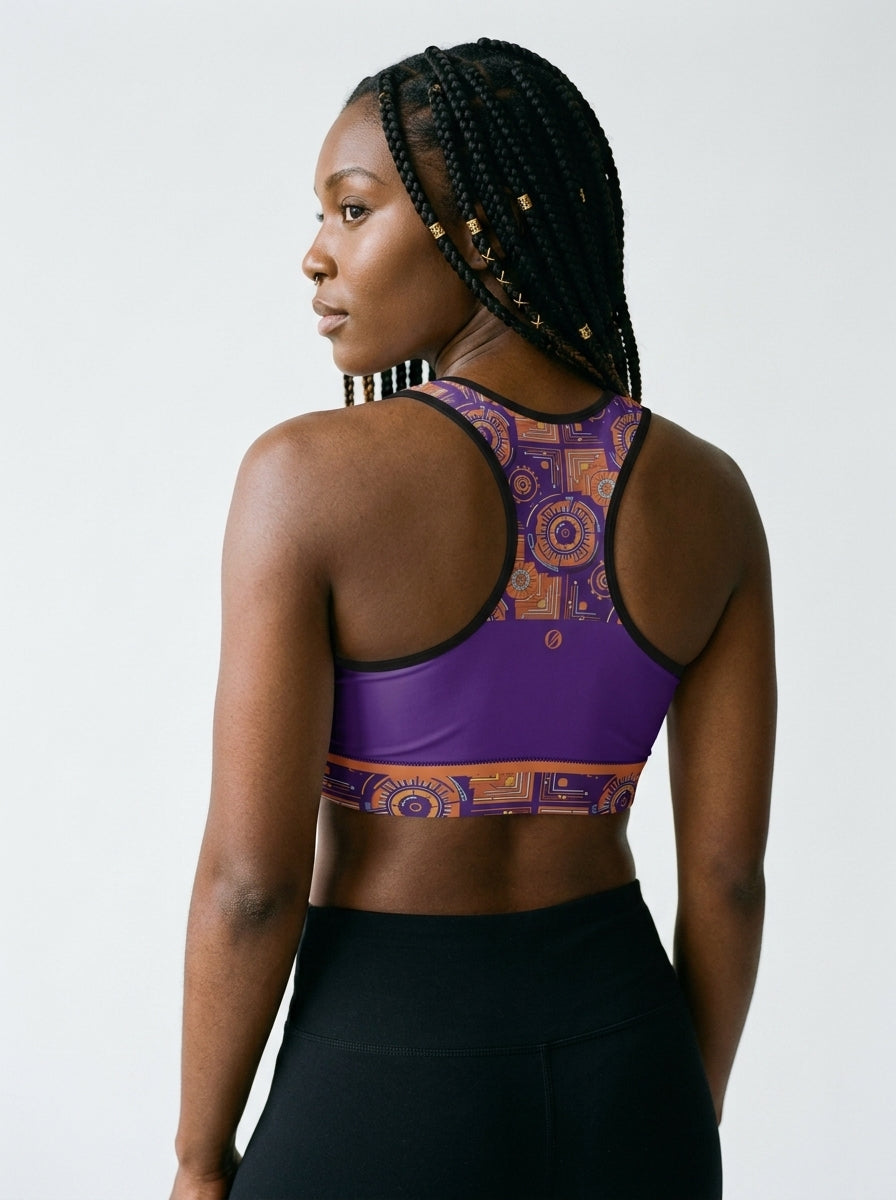 Sankofa Padded Sports Bra in the Kinetic Engine print, outdoor candid shot — SunBorn