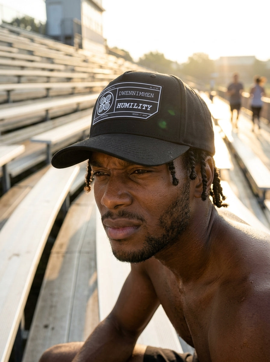 Adinkra // Humility Cap in Oji Black — action lifestyle shot — SunBorn