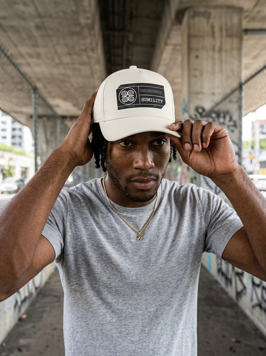 Adinkra // Humility Cap in Oji Black — action lifestyle shot — SunBorn