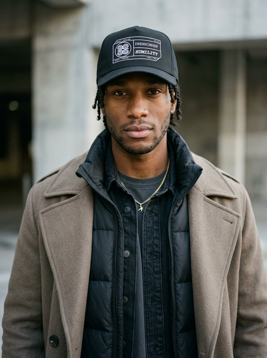 Adinkra // Humility Cap in Oji Black — layered under outerwear — SunBorn